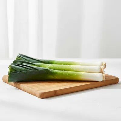 Fresh leeks on a cutting board