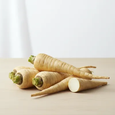 Fresh parsnips on a wooden table