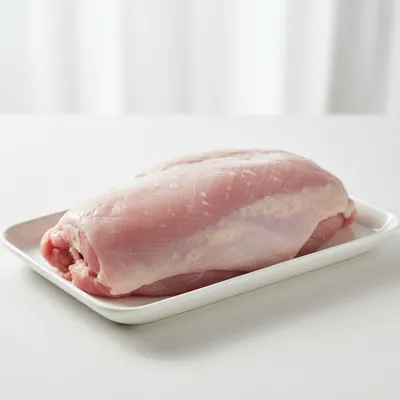 Raw turkey breast on a tray